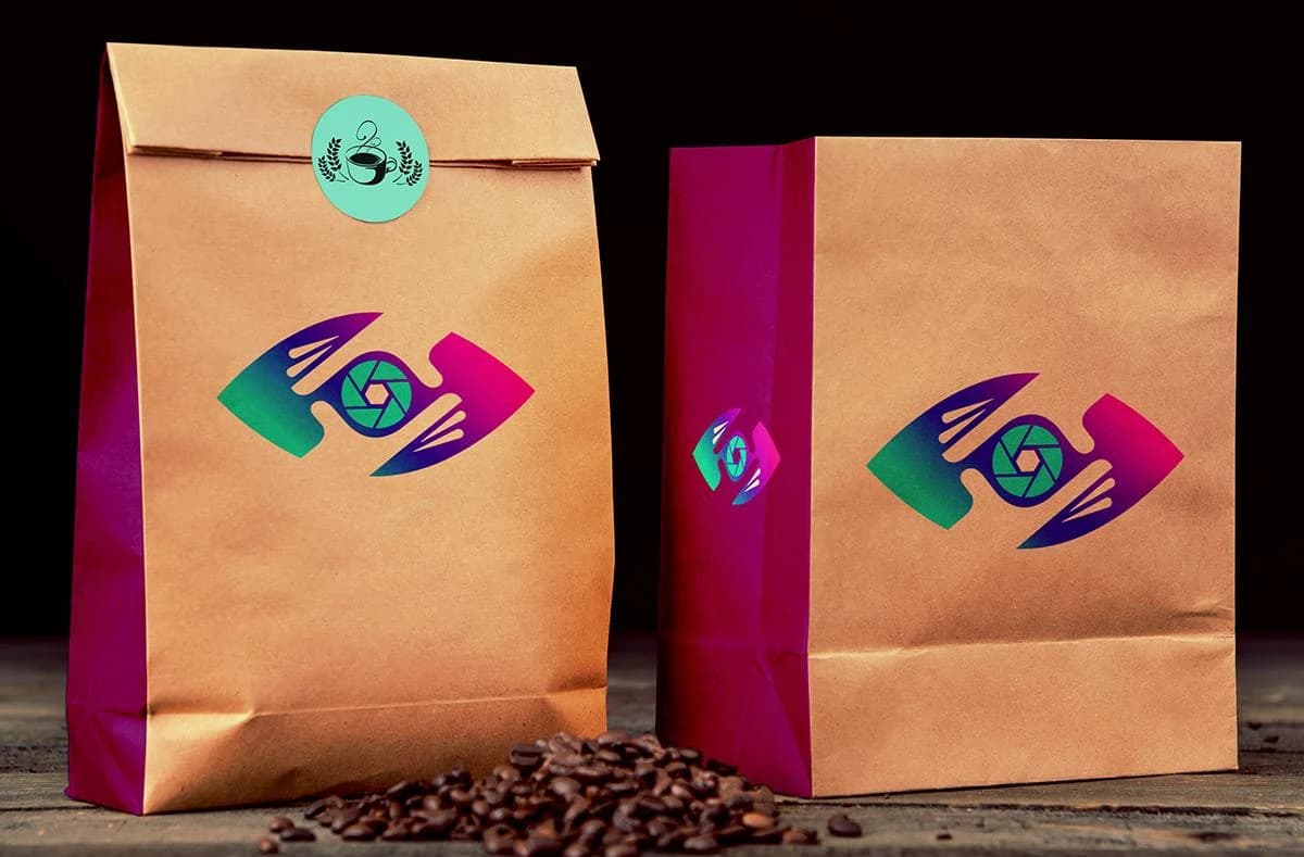 Front-facing kraft coffee bags featuring the green-to-magenta Capture That Media logo