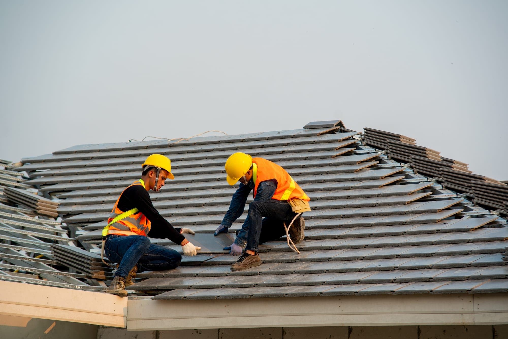 Roofing crew installing a new roof in Houston