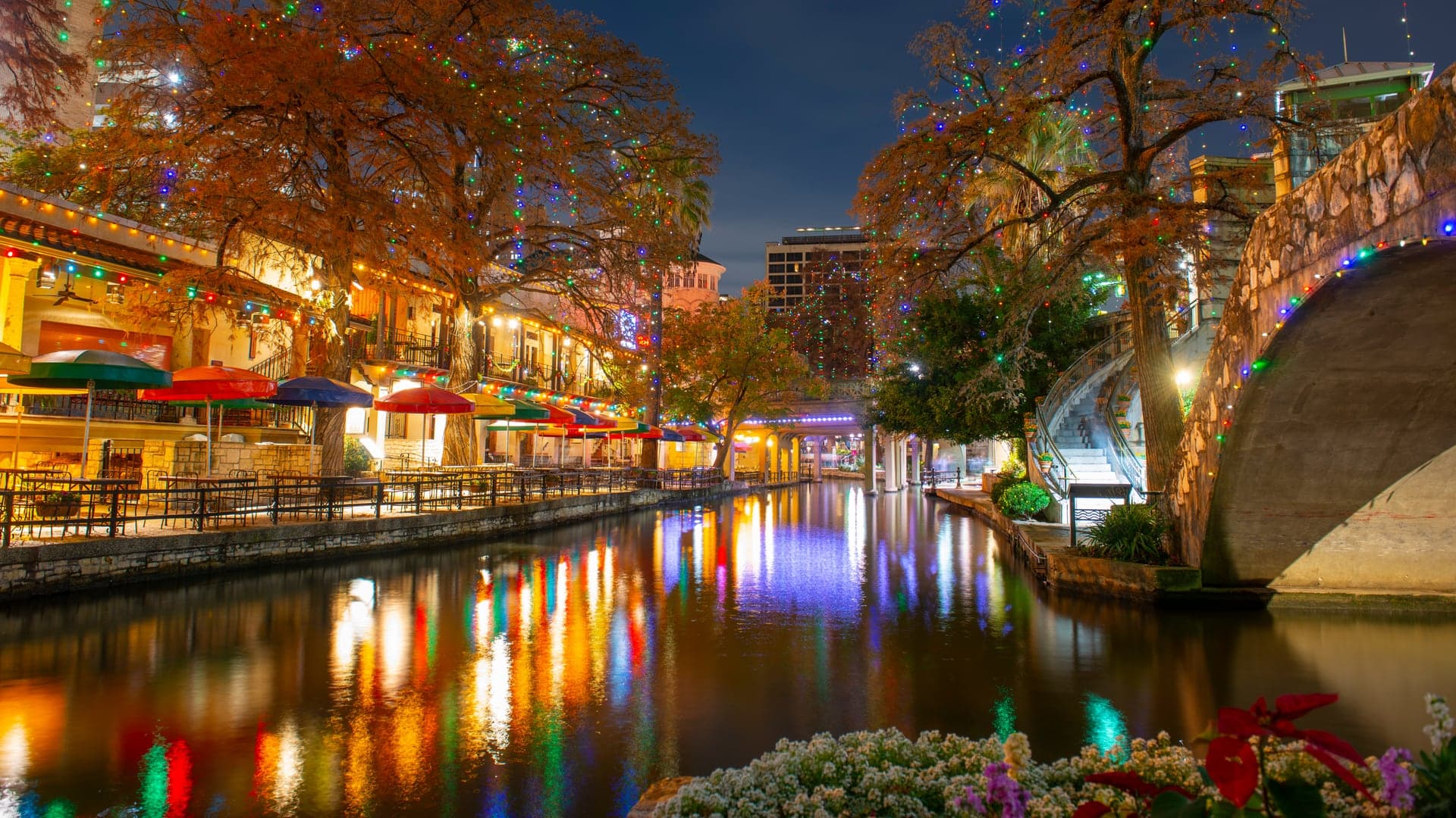 The San Antonio River Walk and a stone bridge over the river in downtown San Antonio, Texas