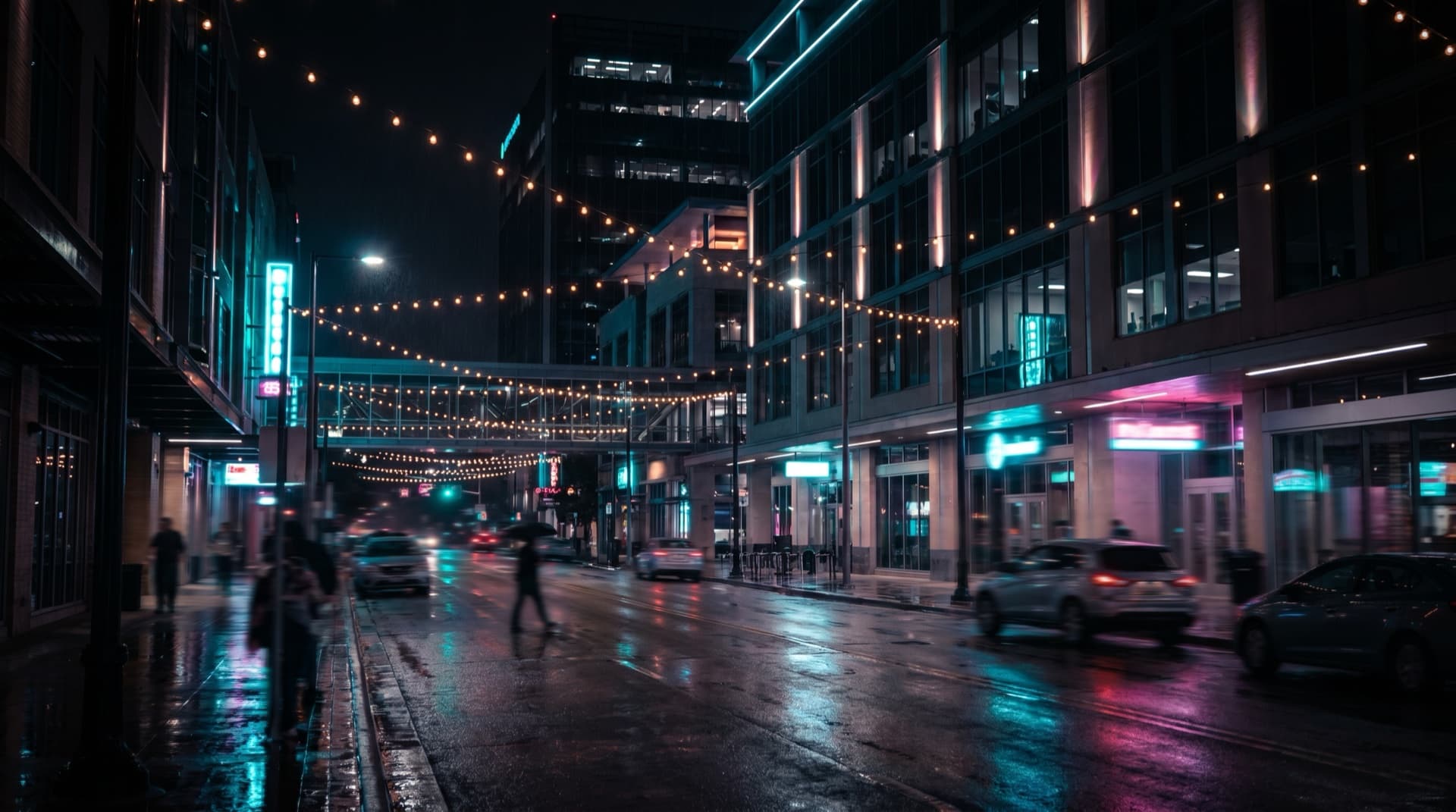 A vibrant San Antonio nightlife street glowing with warm and neon light