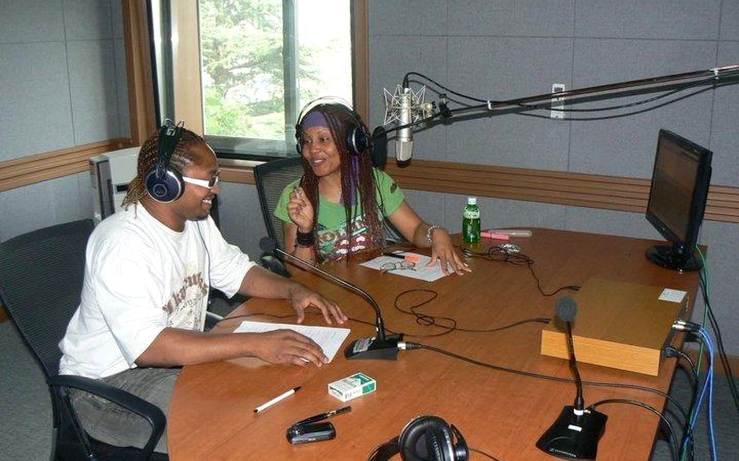 Roger Wong Won interviewing a guest on his English-language talk show at Arirang Radio in Seoul